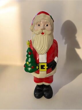 Red Santa Figurine Holiday Decoration with Green Tree